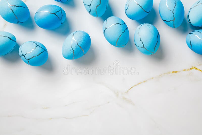 Minimal Easter background with blue eggs on stone table royalty free stock photos