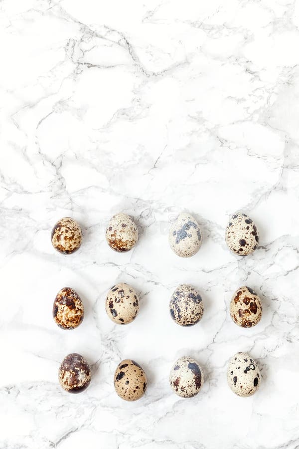 Minimal easter decoration with eggs on white marble background royalty free stock photos