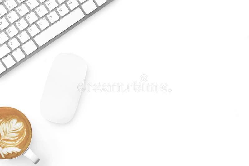 Minimal white office desk table with computer mouse and keyboard and latte coffee. Top view with copy space, flat lay royalty free stock photography