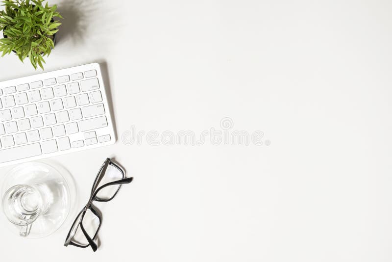 Minimal white office desk table. Top view with copy space, flat lay stock photos