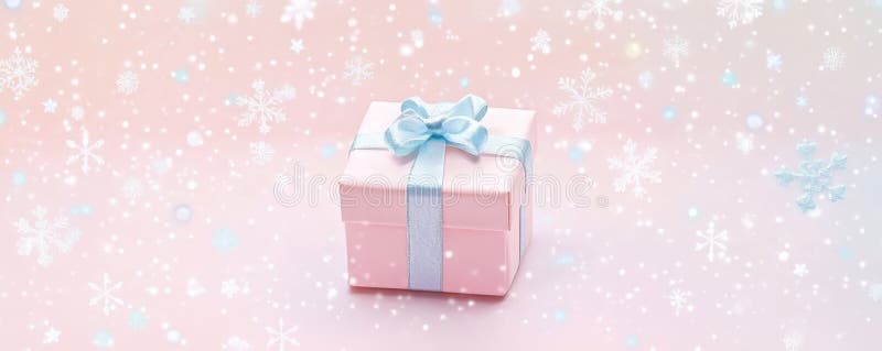 A minimalist background with a focus on a single, elegantly wrapped gift box in the center royalty free stock image