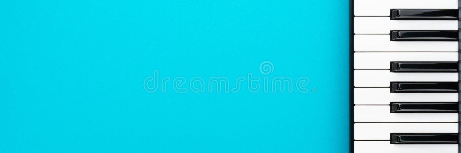 Minimalist photo of piano keyboard over turquoise blue background. Top view of piano keys with copy space. Minimalist photo of midi keyboard over turquoise blue stock photo Minimalist photo of piano keyboard over turquoise blue background. Top view of piano keys with copy space. Minimalist photo of midi keyboard over turquoise blue stock photo