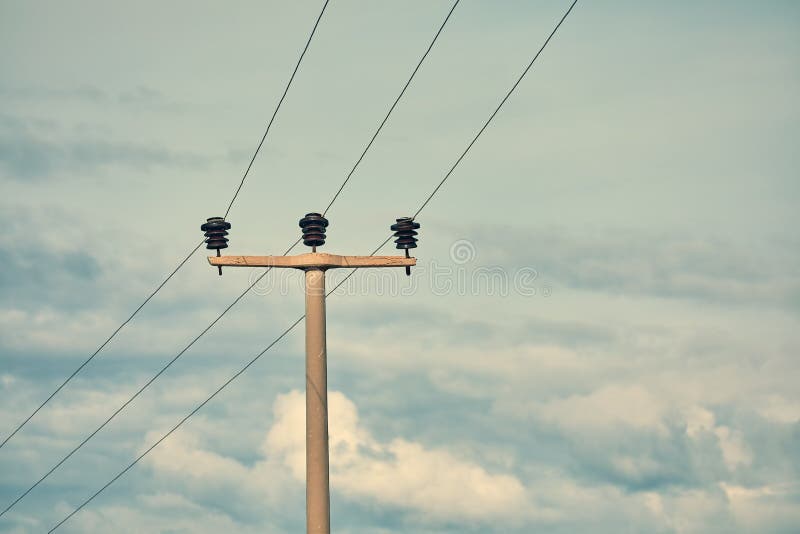 High voltage power electric pole, power lines and fuses royalty free stock image