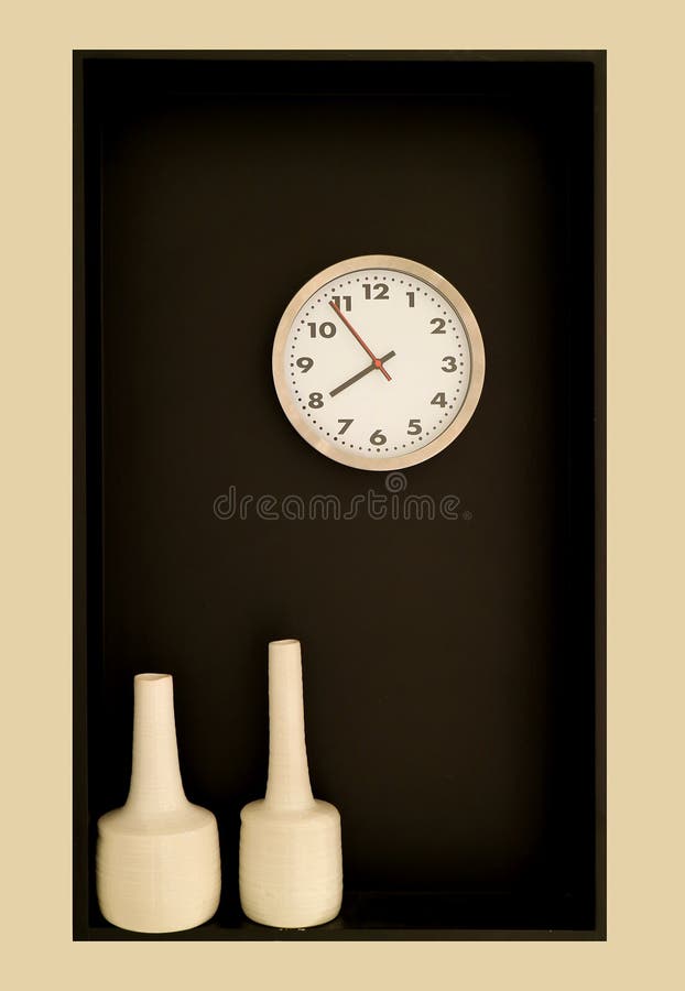 Minimalist Wall Decoration with a Round Shaped Clock and Pair of Vases