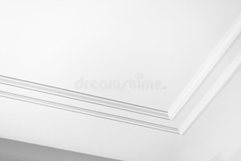 Minimalist White Ceiling Design with Elegant Architectural Molding stock photography