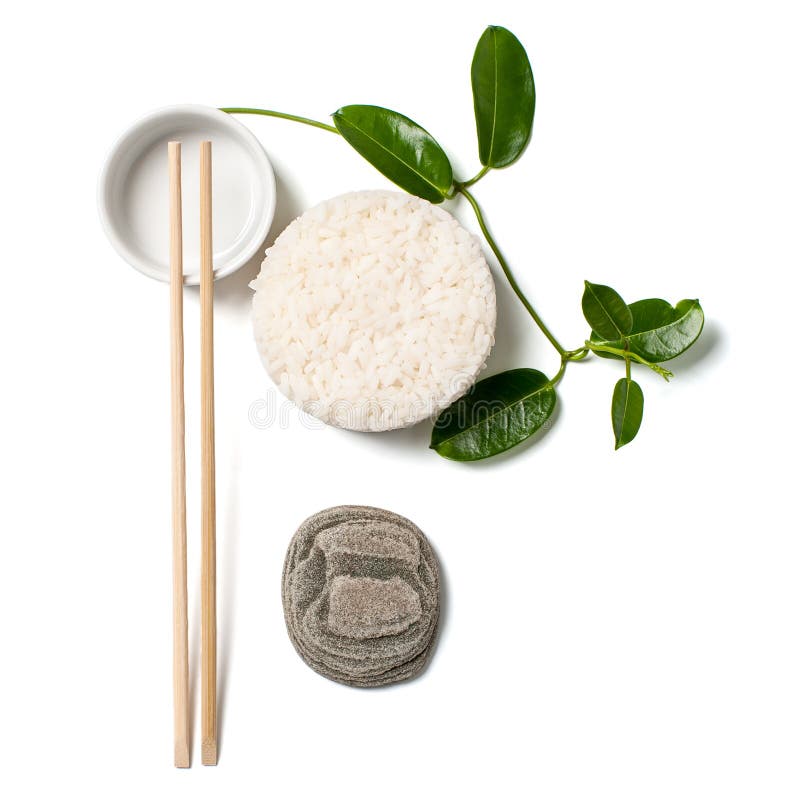 Minimalistic skład z białymi ryż i chopsticks na bielu fotografia stock