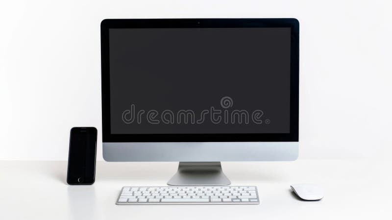 Minimalistic workspace setup with modern desktop computer, smartphone, and peripherals on a white desk. Perfect for stock photos