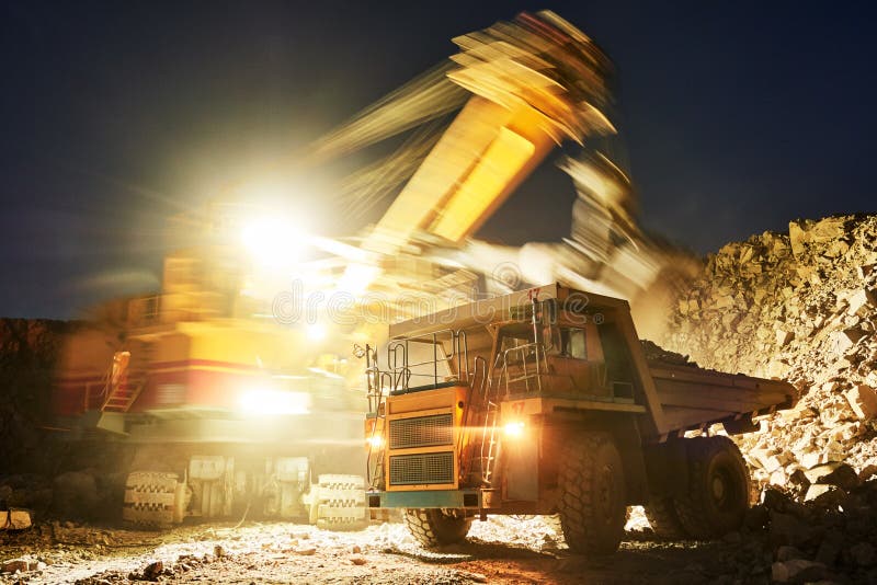 Mining. excavator loading granite or ore into dump truck stock photos Mining. excavator loading granite or ore into dump truck stock photos