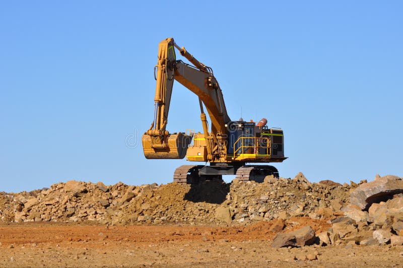 Mining excavator waiting for a truck