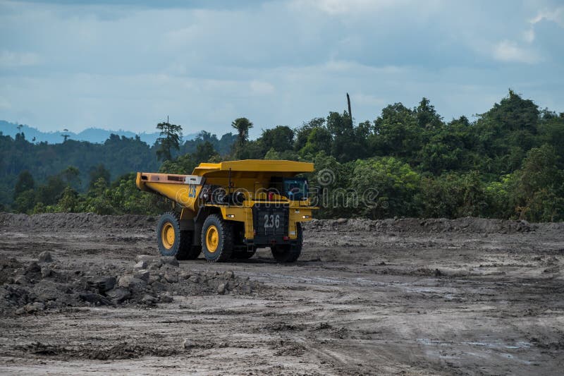 Mining truck mining machinery, to transport coal from open-pit as the Coal Production royalty free stock image