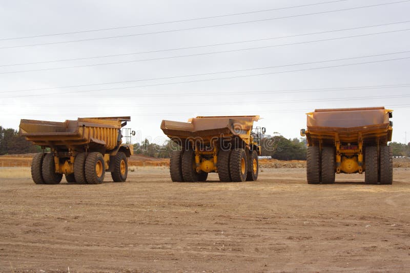 Mining trucks at industrial site. Mining trucks at industrial site