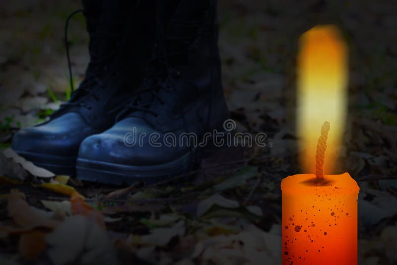 Memorial Day Israel. Memorial Day for Fallen Soldiers and Hostile Actions Casualties. Israel`s official Remembrance day. Burning candle on the background of soldiers` boots. Memorial Day Israel. Memorial Day for Fallen Soldiers and Hostile Actions Casualties. Israel`s official Remembrance day. Burning candle on the background of soldiers` boots