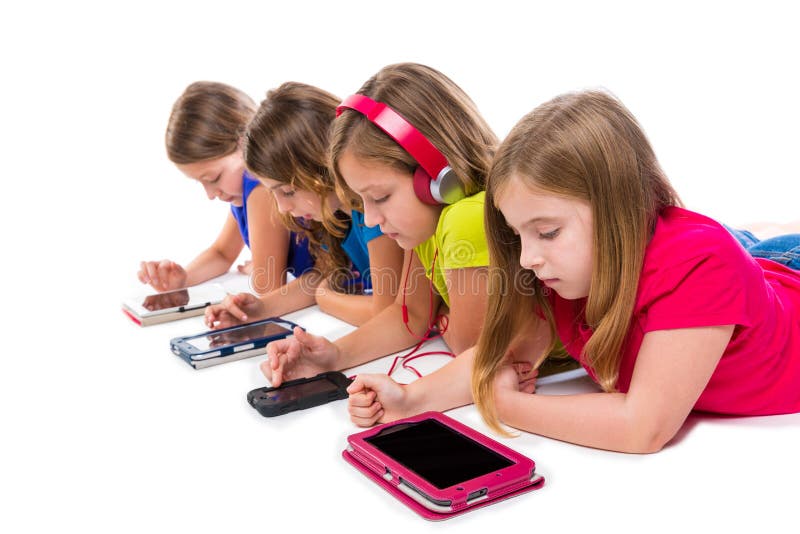 Sisters cousins kid girls with tech tablets and smatphones in a row lying on white background. Sisters cousins kid girls with tech tablets and smatphones in a row lying on white background