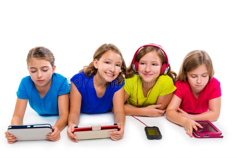 Sisters cousins kid girls with tech tablets and smatphones in a row lying on white background. Sisters cousins kid girls with tech tablets and smatphones in a row lying on white background