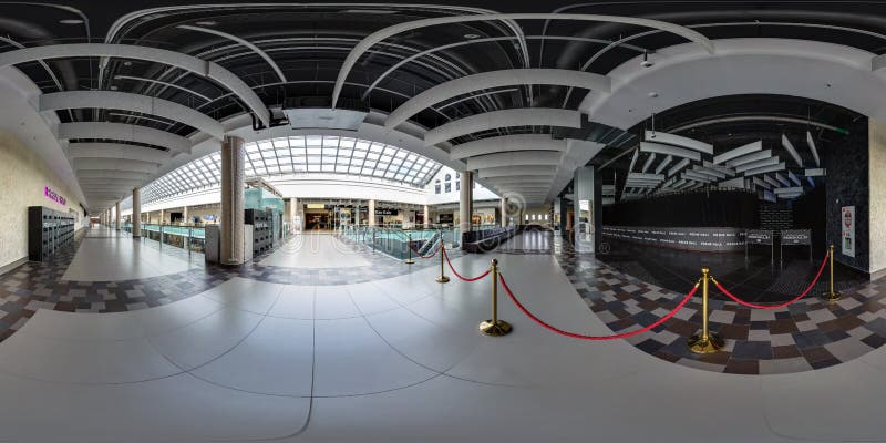 MINSK, BIELORRUSIA - OCTUBRE DE 2016: panorama inconsútil completo 360 grados de opinión de ángulo en pasillo del centro comercia imagen de archivo MINSK, BIELORRUSIA - OCTUBRE DE 2016: panorama inconsútil completo 360 grados de opinión de ángulo en pasillo del centro comercia imagen de archivo