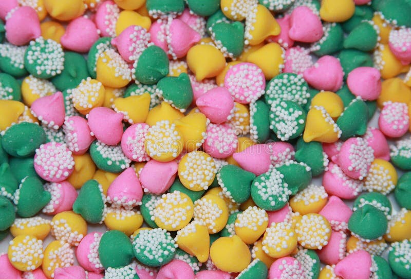 Close up of brightly colored drop shaped after dinner mint candies decorated with white nonpareils. Wedding cone stock images, royalty-free photos and pictures
