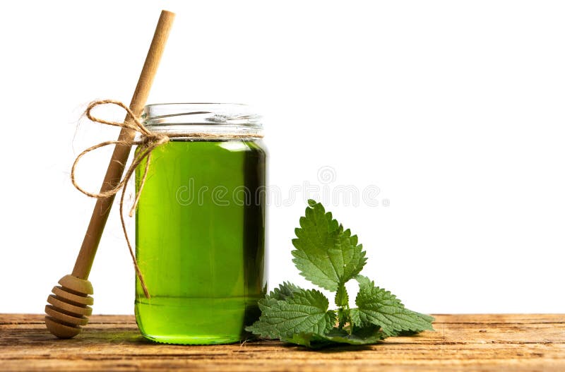 Mint leaf green honey in a jar isolated