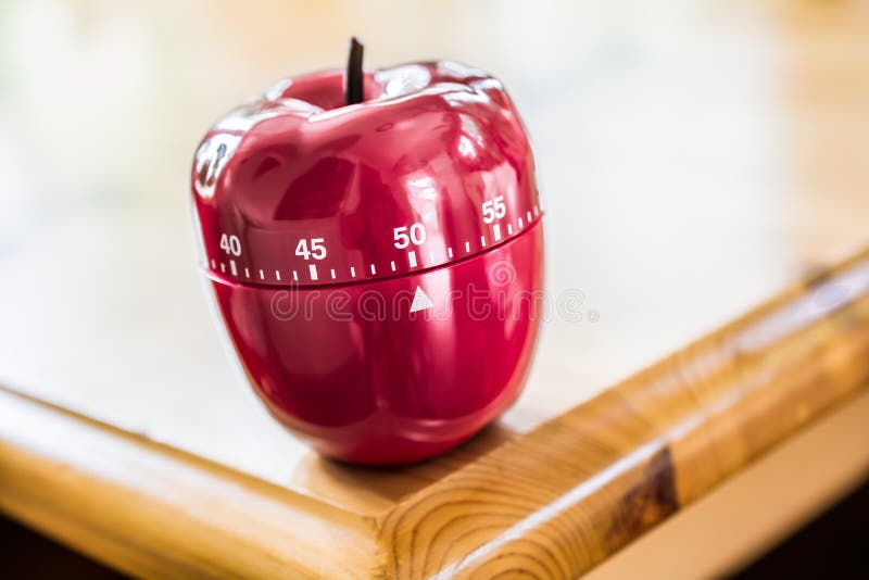 50 Minutes Kitchen Egg Timer in Apple Shape on Wooden Table Stock