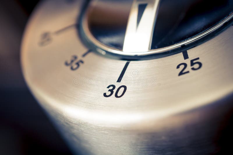30 Minutes - Macro Of An Analog Chrome Kitchen Timer With Dark Background stock images 30 Minutes - Macro Of An Analog Chrome Kitchen Timer With Dark Background stock images