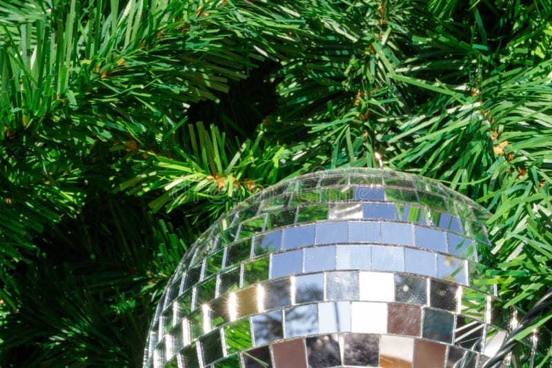 Mirror Ball on Christmas Tree with Sparkle Reflection Stock Photo
