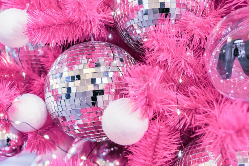 Mirrored Disco Ball and Christmas Decorations on a White Background