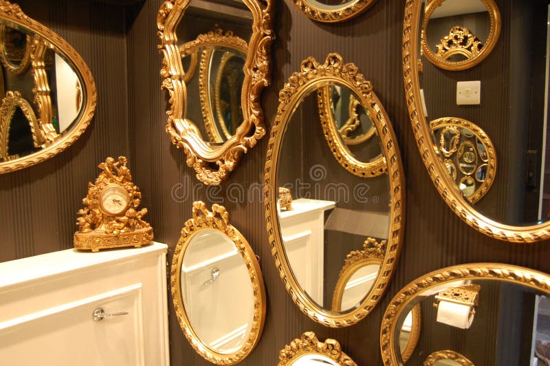 Mirrors. Gold framed mirrors in a loo royalty free stock photos