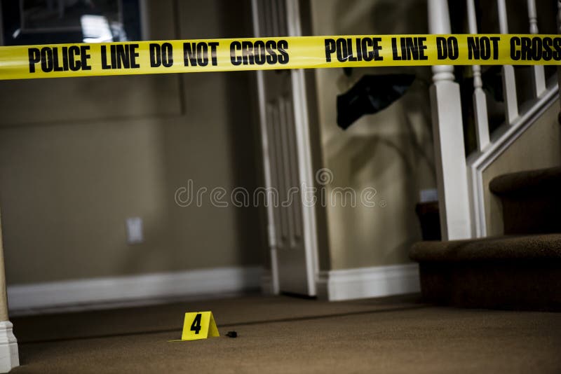 The number 4 crime scene marker on the floor of a house. The number 4 crime scene marker on the floor of a house.