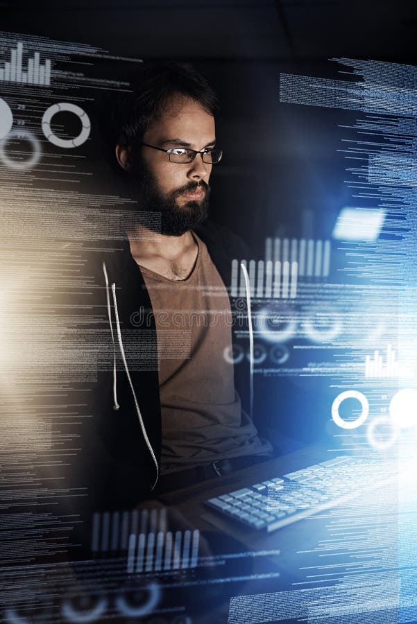 He misses nothing. a young computer programmer working on source code. royalty free stock photography