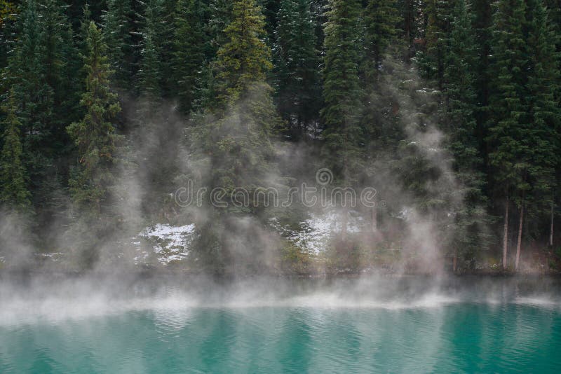 Mist rising from mountain lake