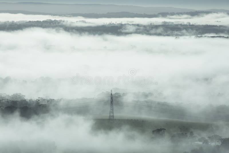 Misty Australian Landscape at Sunrise stock photos