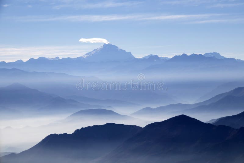 Misty blue Andean mountain landscape background