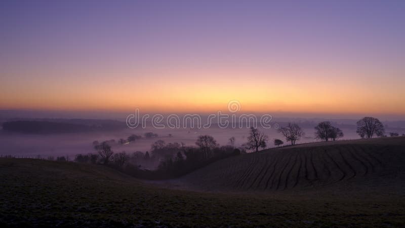Misty morning sunrise over the Hambledon valley, Hampshire, UK stock images Misty morning sunrise over the Hambledon valley, Hampshire, UK stock images