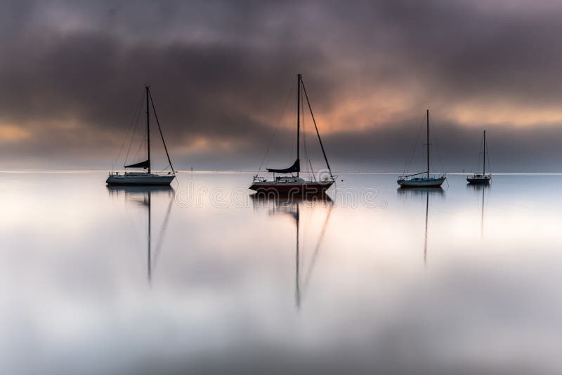 Misty Morning Sunrise Waterscape with Boats. Misty Morning Sunrise Waterscape from Koolewong Waterfront on the Central Coast, NSW, Australia royalty free stock image Misty Morning Sunrise Waterscape with Boats. Misty Morning Sunrise Waterscape from Koolewong Waterfront on the Central Coast, NSW, Australia royalty free stock image
