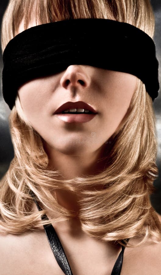 Closeup Of A Beautiful Blond Woman Blindfolded. Closeup Of A Beautiful Blond Woman Blindfolded