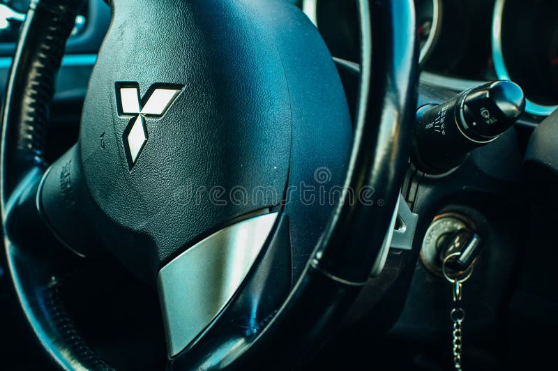 Mitsubishi vehicle. Highlight the steering wheel of the car with the company logo. russia - feb, 2020 royalty free stock photos Mitsubishi vehicle. Highlight the steering wheel of the car with the company logo. russia - feb, 2020 royalty free stock photos