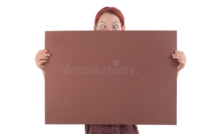 Cross-eyed peering girl holding a big brown notification ad paper. Cross-eyed peering girl holding a big brown notification ad paper