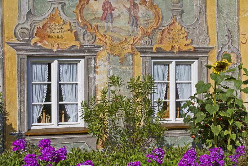 Detail view of a house decorated with paintings in Mittenwald