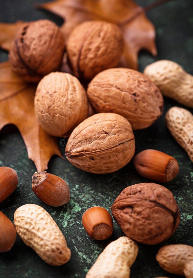 Download Mix Of Different Nuts. Walnuts, Peanuts And Hazelnuts Stock Photo - Image of fresh, healthy ...
