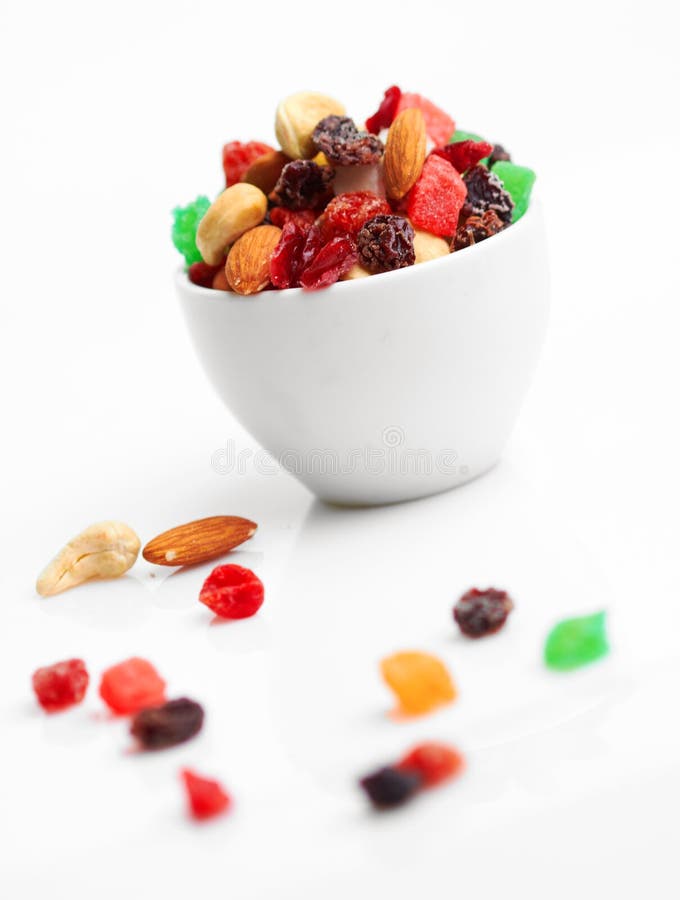 Mix dried fruits and nuts in cup