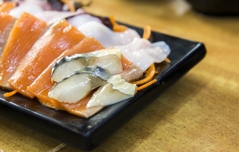 Japanese raw fish, sasimi stock photo. Image of radish