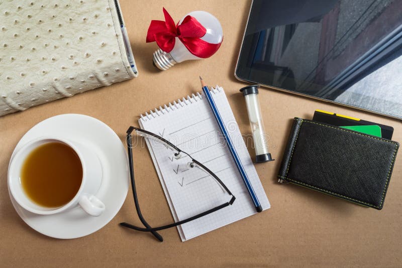 Mix of Office Supplies and Business Gadgets on Office Desk Stock Image