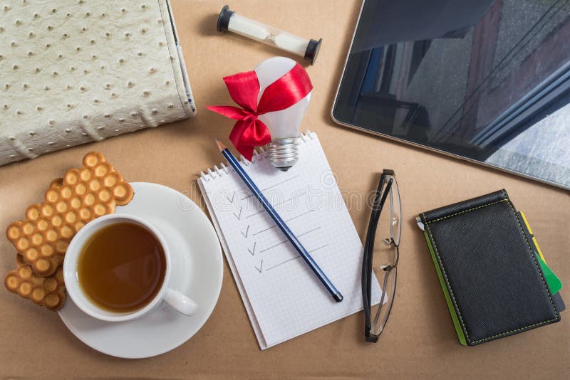 Mix of Office Supplies and Business Gadgets on Office Desk Stock Photo