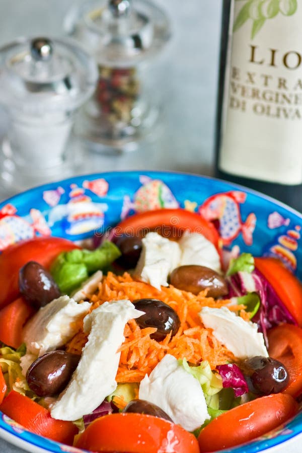 Mix salad with mozzarella and olives