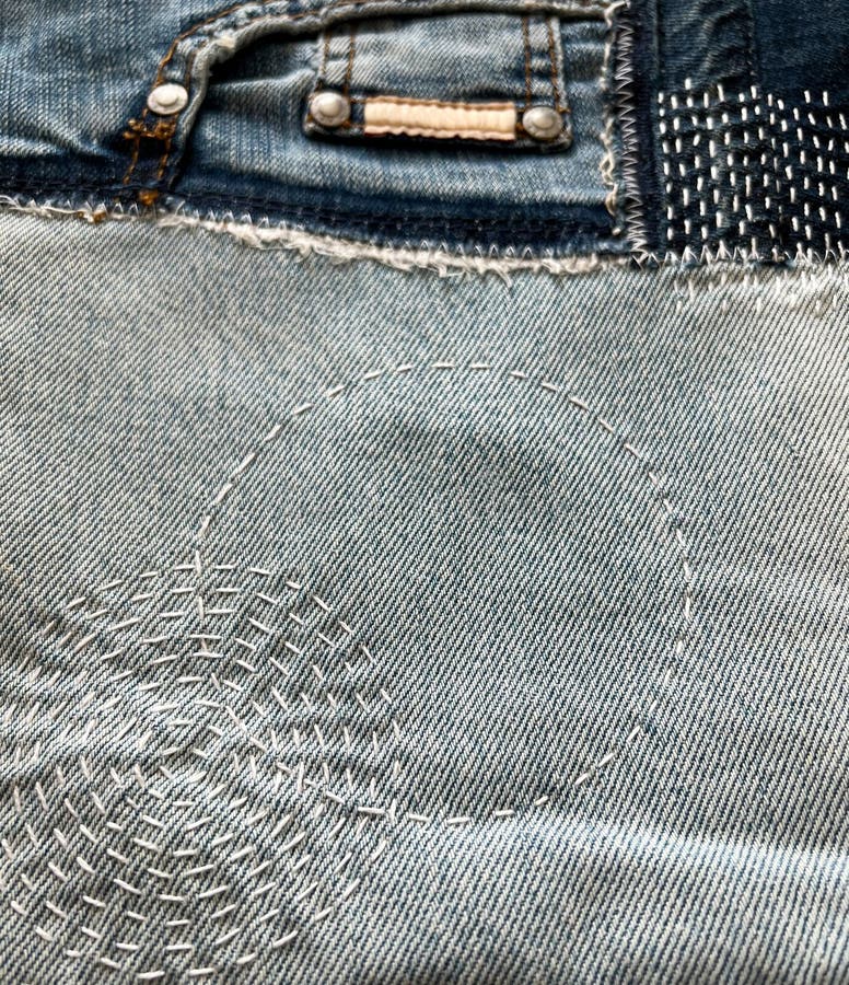 Mixed Denim Jeans Fabric with White Stitched and Metal Pegs Stock Photo