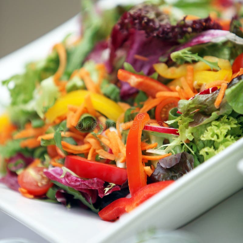 Mixed fresh salad of various vegetables - royalty free stock photo