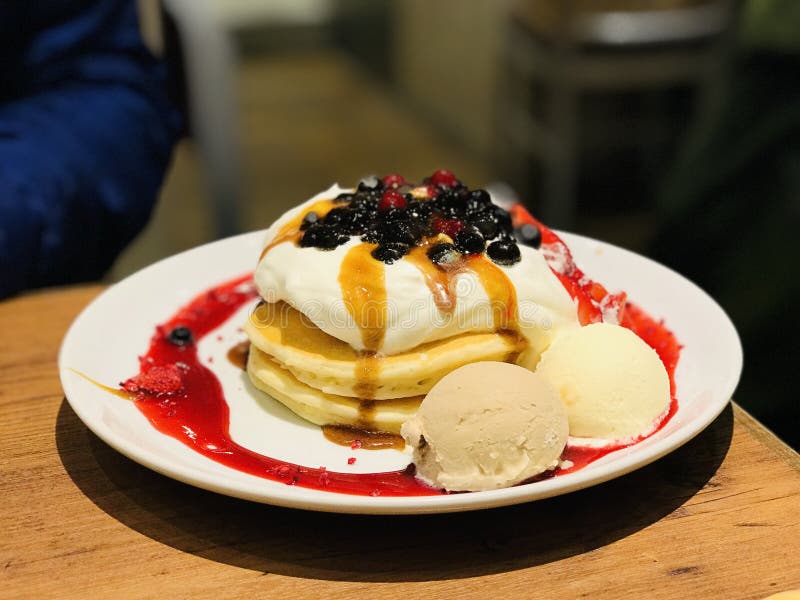 Mixed Fruit Pancake Served With Whipped Cream And Ice Cream. Stock