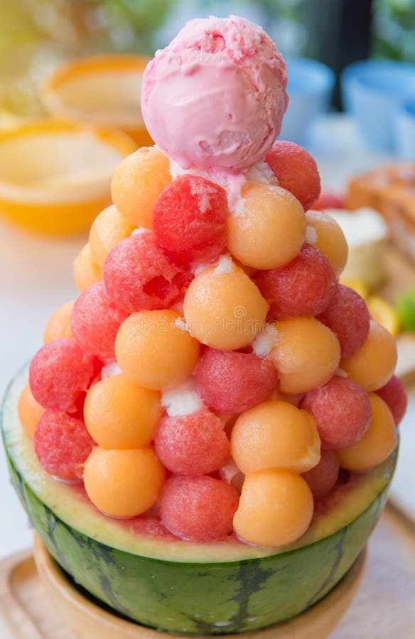 Mixed Fruit with Sweetened Condensed Milk on Ice Cream Stock Photo