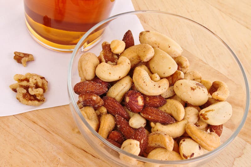 Mixed nuts with beer stock image. Image of almond, table 11634555
