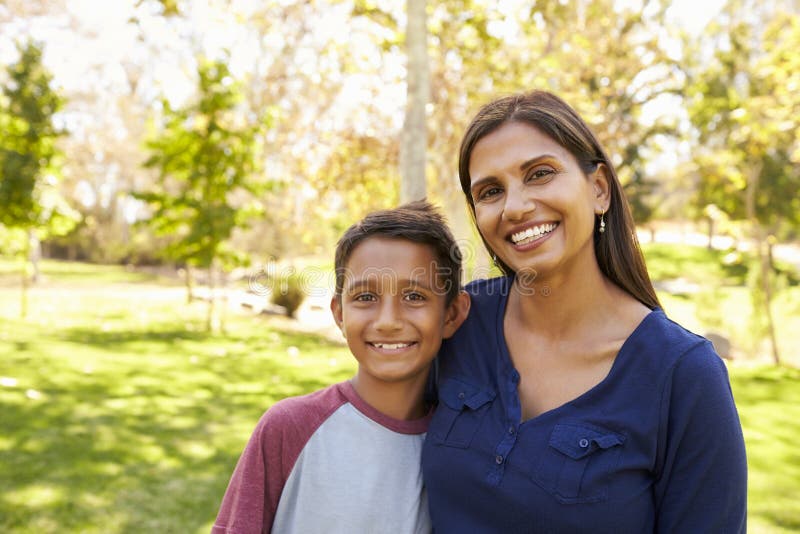 Mixed race Asian Caucasian mother and son in park, portrait