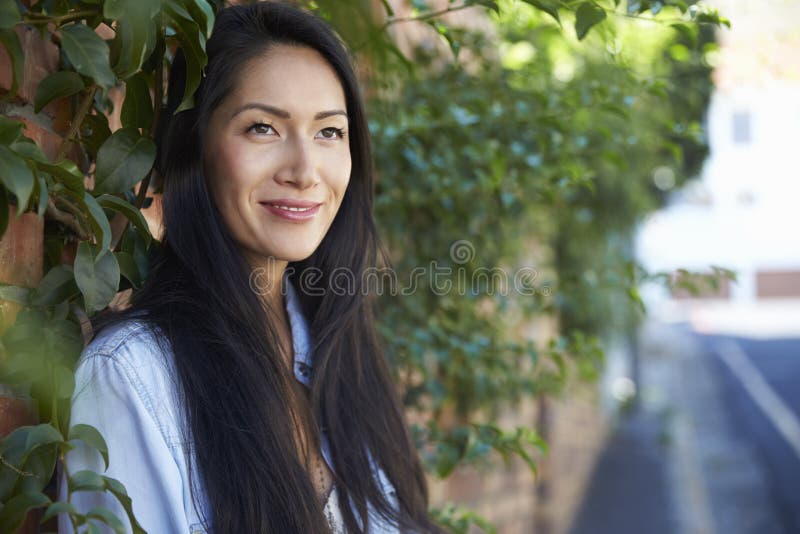 Mixed Race Asian Woman Outdoors Looking Away, Horizontal Stock Image